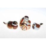 Collection of three Royal Crown Derby paperweights including monkeys.