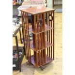 Mahogany three tier revolving bookcase, 43cm by 105.5cm.