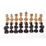 Boxed set of satin and black wood chess pieces.