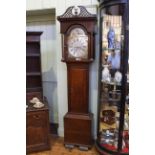 Antique oak eight day longcase clock having arched brass and silvered moon phase dial,
