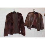 Two ladies mid brown fur jackets.