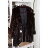 Ladies dark fur coat.