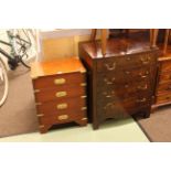 Mahogany four drawer bow front chest and four drawer campaign style pedestal chest.