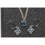 9 carat white gold pendant and earring set.