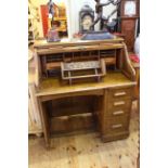 Early 20th Century Lebus oak single pedestal roll top desk, 107cm by 120cm.