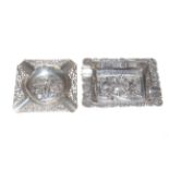Two Dutch silver repousse ashtrays decorated with figures in Inn scenes,