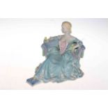 Wade figure of seated elegant lady with budgerigar.