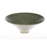 Chinese green glazed bowl with incised foliate decoration, 26cm diameter.