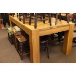 Rectangular light oak dining table.