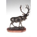 Bronzed effect model of stag on wood plinth.