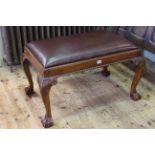 Chippendale style mahogany and leather stool on ball and claw legs.