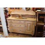 Waxed pine chiffonier having shaped shelf back above three drawers and cupboard door on turned feet,