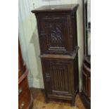 Oak Gothic style two door slim cabinet, 127cm by 46cm.