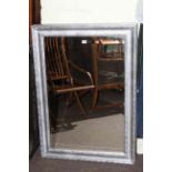Pair silvered framed rectangular bevelled wall mirrors, 107cm by 76cm overall.