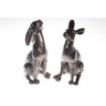 Two bronzed effect models of seated hares.