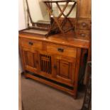 Art Nouveau style oak two door sideboard with fretwork back.