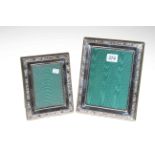 Two silver photograph frames, 18cm by 14cm and 18cm by 22cm.