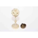 Ivory puzzle ball on stand and nut shaped thimble case (2).