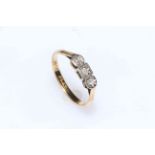 18 carat gold and platinum three stone diamond ring.