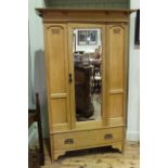 Early 20th Century stripped oak mirror door wardrobe with base drawer, 201cm by 125cm.