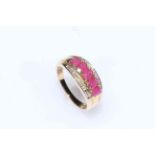 9 carat gold, ruby and diamond ring, having row of five rubies, size M.