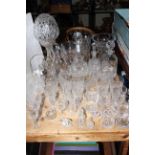 Good collection of crystal and other glass including lamp and shade, vases, decanters, jugs,