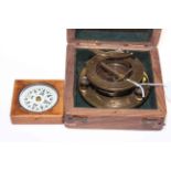 Two boxed compasses.