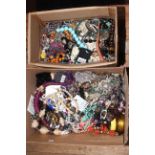 Two boxes of costume jewellery.