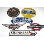 Six cast metal signs including Triumph Bonneville, Harley Davidson, Michelin Tyres, etc.