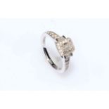 18 carat white gold diamond ring with baguette and brilliant cut diamonds and hidden sapphire,