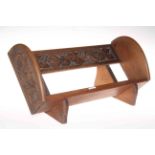 Arts & Crafts hand carved hardwood book rest with decoration of fruit and foliage to the front and