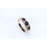 Sapphire and diamond ring set in 9 carat gold.