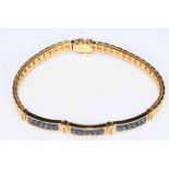 Sapphire and diamond ladies bracelet set in 18 carat yellow gold, boxed.