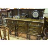 Early 20th Century carved oak Jacobean style three door sideboard with raised back, 141cm by 183cm.