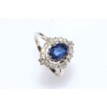 Oval sapphire and diamond cluster ring,