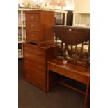 Stag two drawer dressing table, five drawer chest and three drawer pedestal chest.