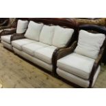 Early 20th Century bergere panelled three piece lounge suite.