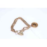 9 carat gold double chain link bracelet with gold fob.