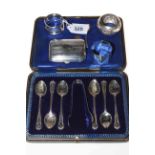 Cased set of silver teaspoons and tongs, three silver napkin rings, cigarette case and salt spoon.