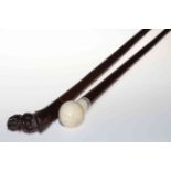 Hippo carved hardwood walking stick and ivory handled walking stick (2).