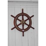 Mahogany and brass ships wheel.