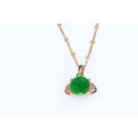 Green stone 14k gold mounted pendant with 18 carat gold necklace.