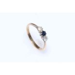 9 carat gold sapphire and two diamond ring, size R.