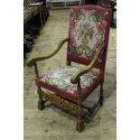 Carved high back open armchair in floral tapestry fabric.