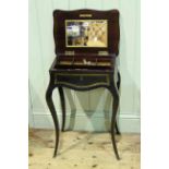 Victorian ebonised and inlaid work table on cabriole legs, 70cm by 47cm.