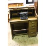 Early 20th Century Lebus oak single pedestal roll top desk, 120cm by 117cm.