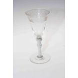 Antique wine glass with vine engraved bowl.