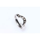 18 carat white gold and diamond shaped band ring, size N.