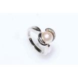 Circular cultured pearl and diamond ring set in 18 carat white gold, size K½.