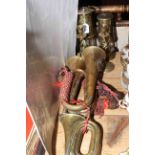 Two brass miners lamps, pair of twist candlesticks,